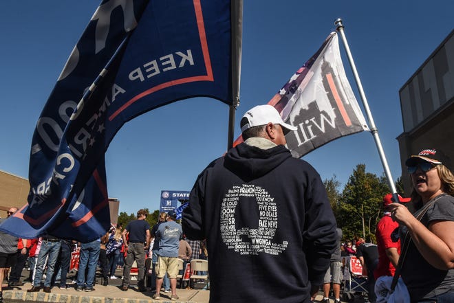 Supporter of President Donald Trump in a QAnon sweatshirt at a rally on Oct. 3, 2020, in Staten Island, New York.