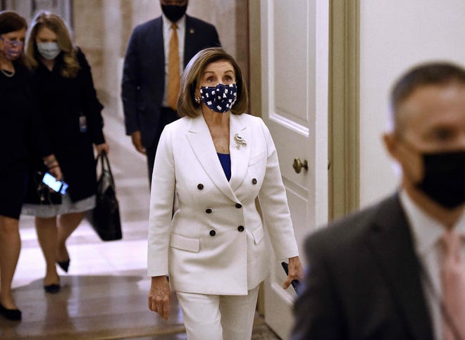 House Speaker Nancy Pelosi, D-Calif., arrives at the U.S. Capitol on Wednesday, when the House is expected to give final passage to President Joe Biden's $1.9 trillion COVID-19 stimulus plan.