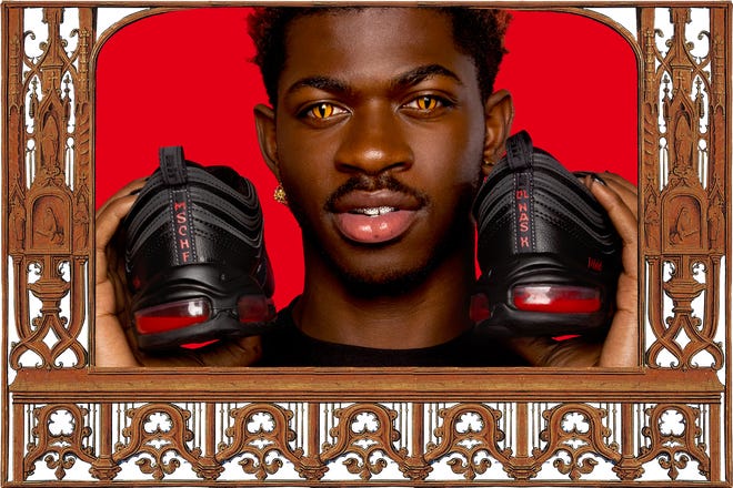 Lil Nas X shows off the Satan Shoes which went on sale Monday.