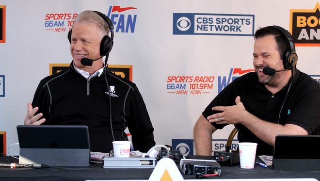 Boomer Esiason and Gregg Giannotti (right) are shown during a break in WFAN’s 