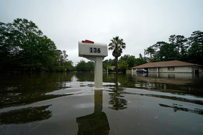 A flooded neighborhood is seen after Tropical Storm Claudette passed through in Slidell, La., Saturday, June 19, 2021.