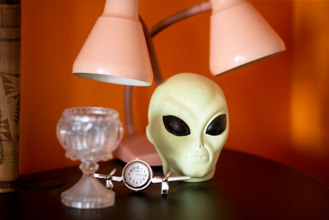 Dave MacDonald, the executive director of MUFON (Mutual UFO Network), has an alien piggy bank in his Flamingo Air office at Lunken Airport on Friday, June 4, 2021 in the East End neighborhood of Cincinnati. MUFON is the largest UFO investigation group in the world. 