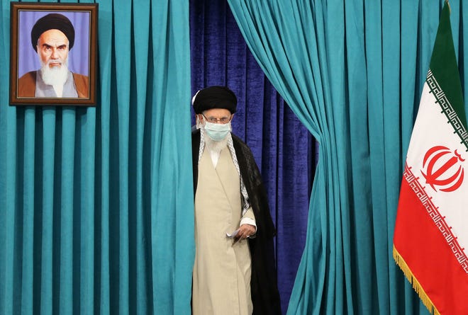 Supreme Leader Ayatollah Ali Khamenei  arrives to cast his ballot on June 18, 2021, in Iran's presidential election.