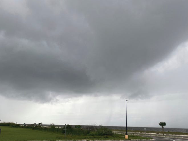 Clouds from Tropical Storm Claudette form on Highway 90 Beaches in Pass Christian, Miss., Friday, June 18, 2021. City of Pass Christian has declared state of emergency for potential severe weather.
