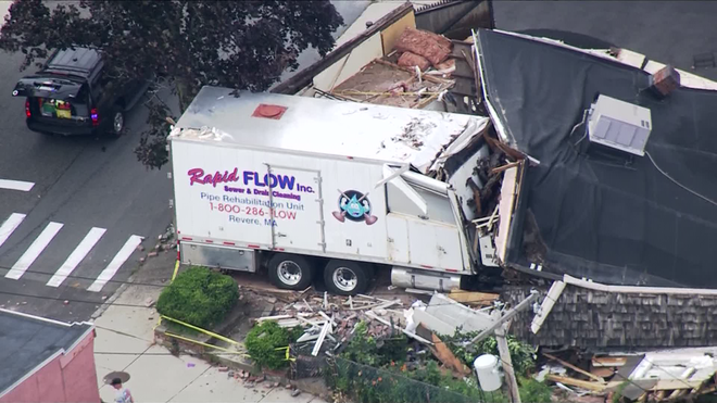 A&#x20;truck&#x20;belonging&#x20;to&#x20;Rapid&#x20;Flow&#x20;Inc.&#x20;crashed&#x20;into&#x20;a&#x20;building&#x20;in&#x20;Winthrop,&#x20;Massachusetts&#x20;and&#x20;leveled&#x20;it&#x20;on&#x20;June&#x20;26,&#x20;2021.&#x20;Police&#x20;say&#x20;the&#x20;crash&#x20;is&#x20;connected&#x20;to&#x20;multiple&#x20;shootings&#x20;that&#x20;happened&#x20;the&#x20;same&#x20;day.