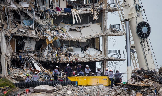 Rescuers continue to search through the rubble  of the Champlain Towers south condo collapse in Surfside, Florida on Tuesday, June 29, 2021.