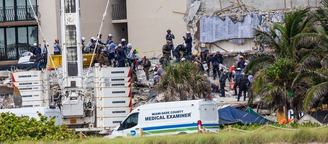 Rescuers continue to search through the rubble  of the Champlain Towers south condo collapse in Surfside, Florida on Tuesday, June 29, 2021.