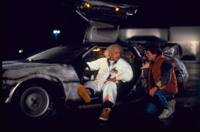 Christopher Lloyd as Doc Brown and Michael J. Fox as Marty McFly in a scene from the motion picture "Back to the Future."