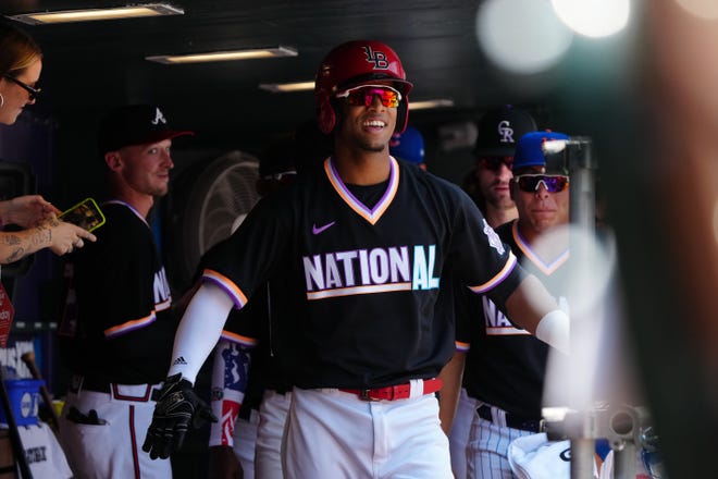 Jul 11, 2021; Denver, CO, USA; National League short stop Jose Barrero (50) celebrates his solo home run in the first inning against the American League in the 2021 MLB All Star Futures Game at Coors Field.