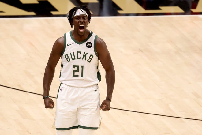 Milwaukee Bucks guard Jrue Holiday reacts after a basket during the first quarter of Game 6 against the Atlanta Hawks.
