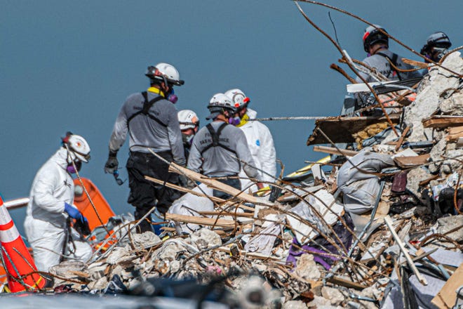 Search and rescue teams search the rubble of the partially collapsed 12-story Champlain Towers South condo building in Surfside, Florida, on July 2.