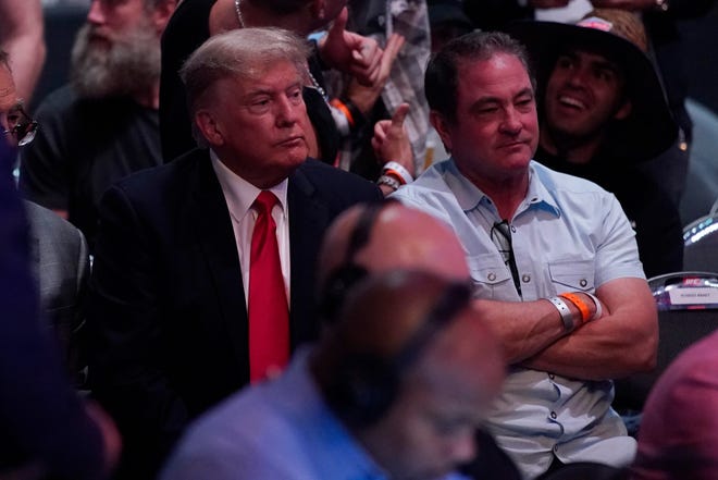 Former U.S. President Donald Trump, left, attends UFC 264.