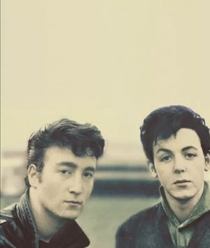 John Lennon, left, Paul McCartney