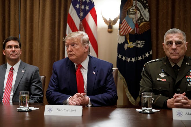 President Donald Trump holds a briefing with Defense Secretary Mark Esper, left, and Joint Chiefs of Staff Chairman Gen. Mark Milley in the Cabinet Room of the White House in October 2019.