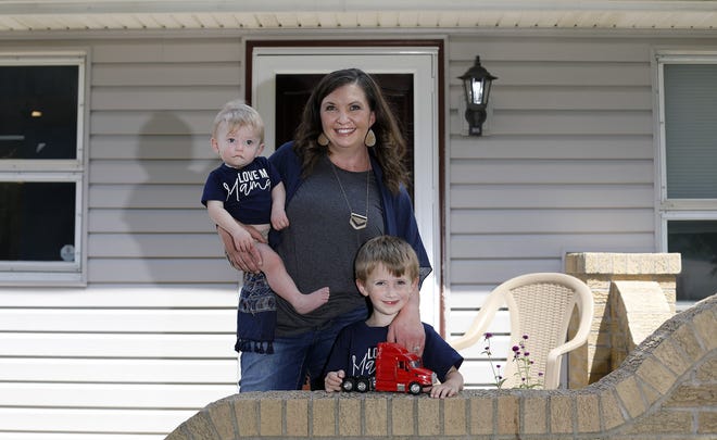 Lyndsey Wilcox poses for a photo with her sons Clayton, 4, and Coleton, 9 months, outside her house in Mount Gilead on July 1, 2021. State lawmakers have proposed a bill that would create Medicaid pilot program for doula care. Lyndsey used a doula for the birth of Coleton. 