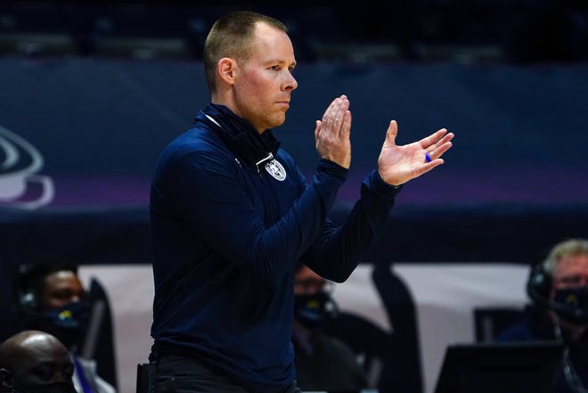 Xavier Musketeers head coach Travis Steele encourages the team in the second half of an NCAA men's college basketball game against the Butler Bulldogs, Saturday, Feb. 20, 2021, at Cintas Center in Cincinnati. The Xavier Musketeers won, 63-51. 