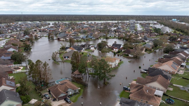 Flooded streets and homes are shown in the Spring Meadow subdivision in LaPlace, La., after Hurricane Ida moved through Monday, Aug. 30, 2021.