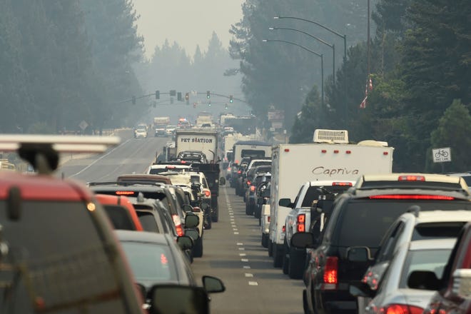 Evacuation traffic backs up in South Lake Tahoe, Calif., as mandatory evacuations are announced due to the Caldor Fire on  Aug. 30, 2021. Thousands of people rushed to get out of South Lake Tahoe as the entire tourist resort city came under evacuation orders and wildfire raced toward the large freshwater lake of Lake Tahoe, which straddles California and Nevada.