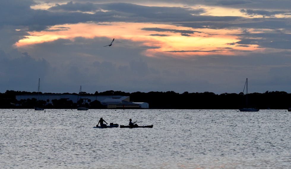 Spectators along the Indian River Lagoon in Titusville, Florida, wait for the launch of the SpaceX Falcon 9 rocket.