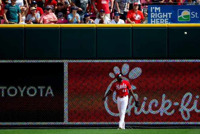 Cincinnati Reds left fielder Aristides Aquino (44) watches as a ball bounces back onto the field as Los Angeles Dodgers catcher Will Smith (16) gets a home run in the second inning of the MLB baseball game between the Cincinnati Reds and the Los Angeles Dodgers on Sunday, Sept. 19, 2021, at Great American Ball Park in Cincinnati. 