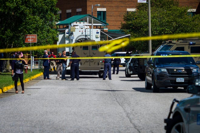 Police respond to the scene of a shooting at Heritage High School in Newport News, Va., on Saturday Sept. 20, 2021.