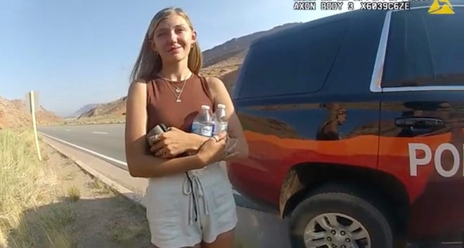 This police camera video provided by The Moab Police Department shows Gabrielle “Gabby” Petito talking to a police officer after police pulled over the van she was traveling in with her boyfriend, Brian Laundrie, near the entrance to Arches National Park on Aug. 12.