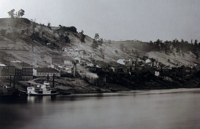 Daguerreotype of the Cincinnati skyline taken by photographers Fontayne & Porter in the fall of 1848 from Newport, Kentucky. To the left above an unnamed steamboat is the building "Passenger Depot Little Miami Railroad." It just commenced train service three weeks prior to the picture being taken and made a trip form Cincinnati to New York possible for the first time in an optimistic 71 hours. The building at center is the first pumping station for the Cincinnati Water Works.
