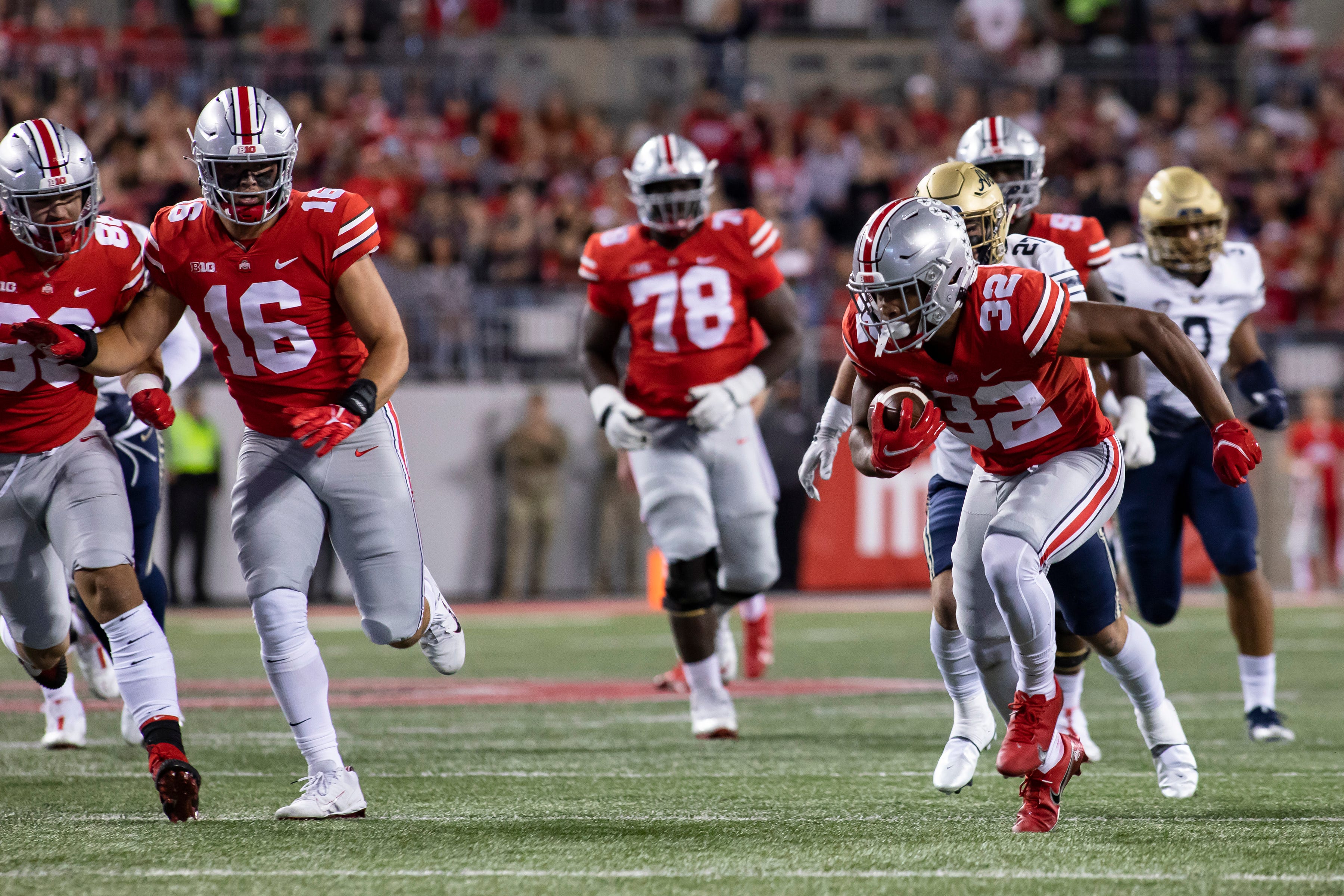 Ohio State Buckeyes running back TreVeyon Henderson (32) runs the ball during the game against the Akron Zips at Ohio Stadium in Columbus, Ohio Sept. 25. Ohio State would win the game 59-7