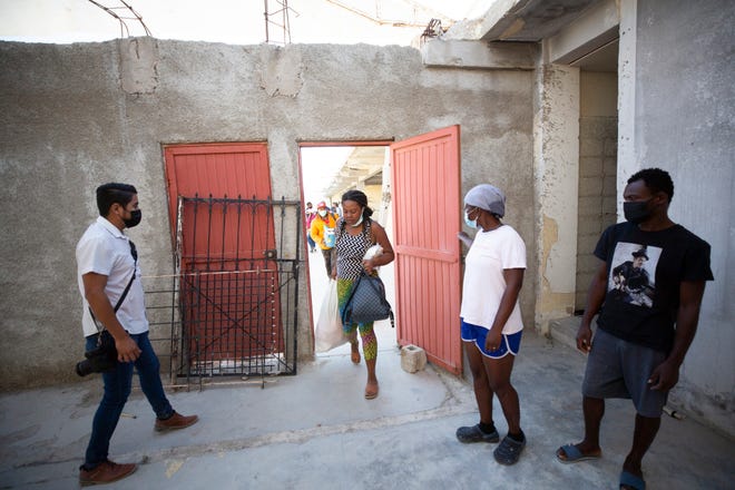 Haitian migrants arrive at a newly designated space as authorities determine their migratory status so they can remain in Ciudad Acuña.