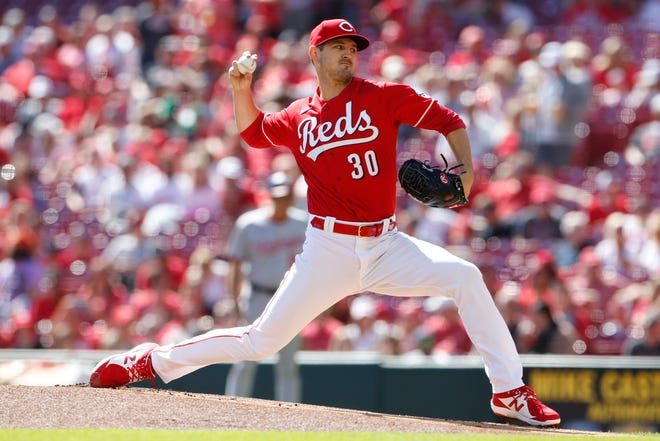 Cincinnati Reds' Tyler Mahle throws a pitch against the Washington Nationals during the first inning of a baseball game Sunday, Sept. 26, 2021, in Cincinnati.