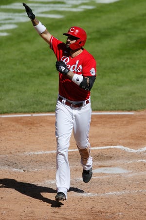 Cincinnati Reds' Nick Castellanos celebrates his home run against the Washington Nationals during the fifth inning of a baseball game Sunday, Sept. 26, 2021, in Cincinnati.
