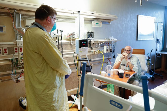 Robert M. Klinestiver, MD, the Medical Director of Pulmonary and Respiratory Services for Hancock Regional Hospital, checks on his Covid-19 patient, Mark Green, on Friday, Sept. 24, 2021, at Hancock Regional Hospital, Greenfield Ind. 
