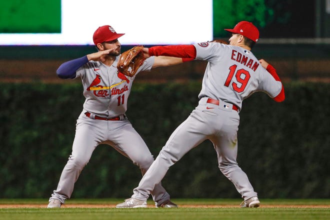 St. Louis Cardinals shortstop Paul DeJong (11) celebrates with third baseman Tommy Edman (19) after a 12-4 win against the Chicago Cubs in game 2 of a doubleheader at Wrigley Field on Sept. 24.