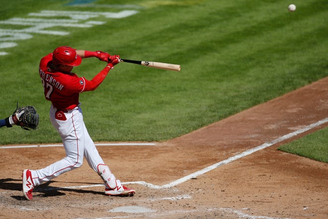 Cincinnati Reds' Tyler Stephenson hits a two-run home run against the Washington Nationals during the fifth inning of a baseball game Sunday, Sept. 26, 2021, in Cincinnati.