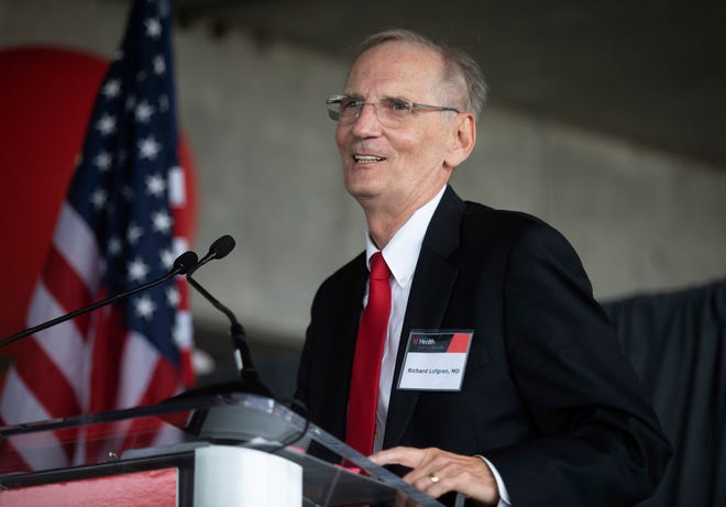 Dr. Richard Lofgren, UC Health president and CEO, addresses the group gathered to take part in the groundbreaking for the new University of Cincinnati Medical Center emergency department and a surgical tower on Sept. 21, 2021.