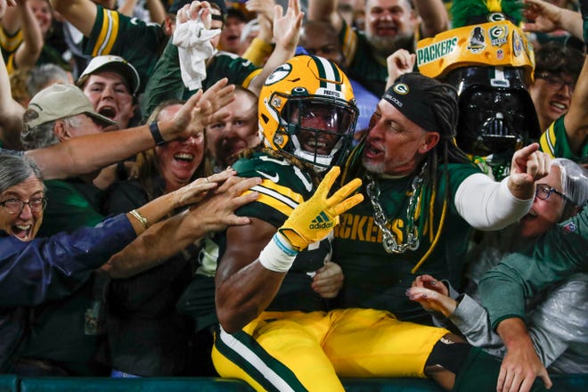 Green Bay Packers' Aaron Jones celebrates his touchdown run during the second half of an NFL football game against the Detroit Lions Monday, Sept. 20, 2021, in Green Bay, Wis. (AP Photo/Matt Ludtke)