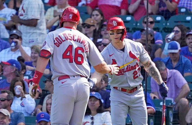 St. Louis Cardinals first baseman Paul Goldschmidt (46) is greeted by left fielder Tyler O'Neill (27) after hitting a home run against the Chicago Cubs during the third inning at Wrigley Field on Sept. 26.