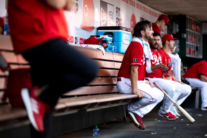 Cincinnati Reds starting pitcher Wade Miley (22) watches as the Cincinnati Reds bat in the first inning of the MLB baseball game between the Cincinnati Reds and the Los Angeles Dodgers on Sunday, Sept. 19, 2021, at Great American Ball Park in Cincinnati. 