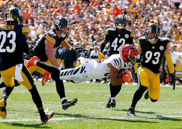 Tyler Boyd #83 of the Cincinnati Bengals scores a touchdown during the first quarter in the game against the Pittsburgh Steelers at Heinz Field on September 26, 2021 in Pittsburgh, Pennsylvania.