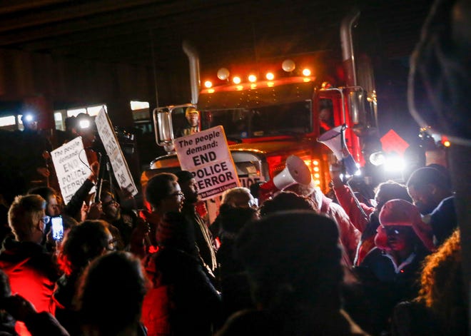 Demonstrators block traffic on Riverside Drive near the Memphis-Arkansas Bridge as they protest the killing of Tyre Nichols on Friday, Jan. 27, 2023, in Memphis, Tenn.