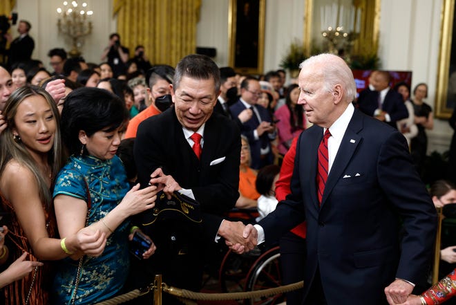 President Joe Biden greets guests at a reception celebrating Lunar New Year in the White House on January 26, 2023 in Washington, DC.