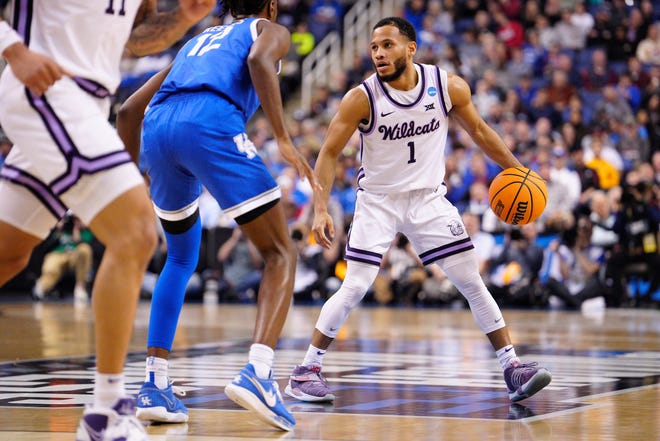 Kansas State's Markquis Nowell dribbles against Antonio Reeves #12 of the Kentucky Wildcats during the first half.