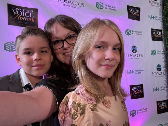 Kim Shappley and her two children, Kaleb, 10, and Kai, 11, at a fundraising event in Connecticut in September 2022. Shappley and her family left Texas to protect Kai, who is transgender, from a climate she felt was hostile to trans kids, including a spate of anti-trans bills introduced by GOP legislators in recent years and Gov. Greg Abbott's directive ordering parents providing youths with gender affirming care to be investigated for child abuse.