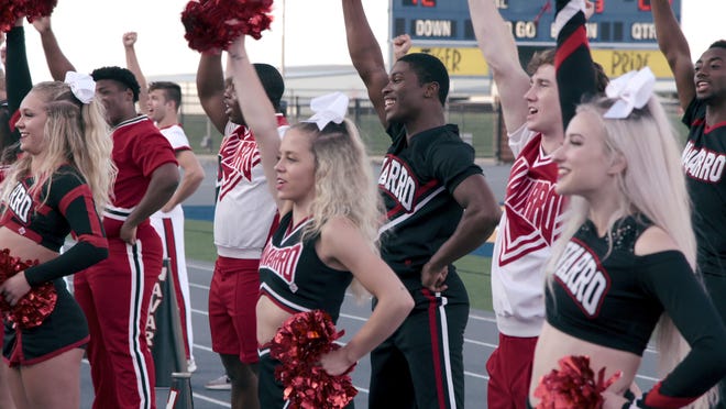 La'Darius Marshall, center, rose to fame after appearing in the Netflix docuseries "Cheer" in 2020.